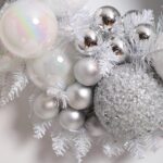 Close-up of blooms and berries on this Iridescent Pine and Mixed Pearlized Door Christmas Wreath