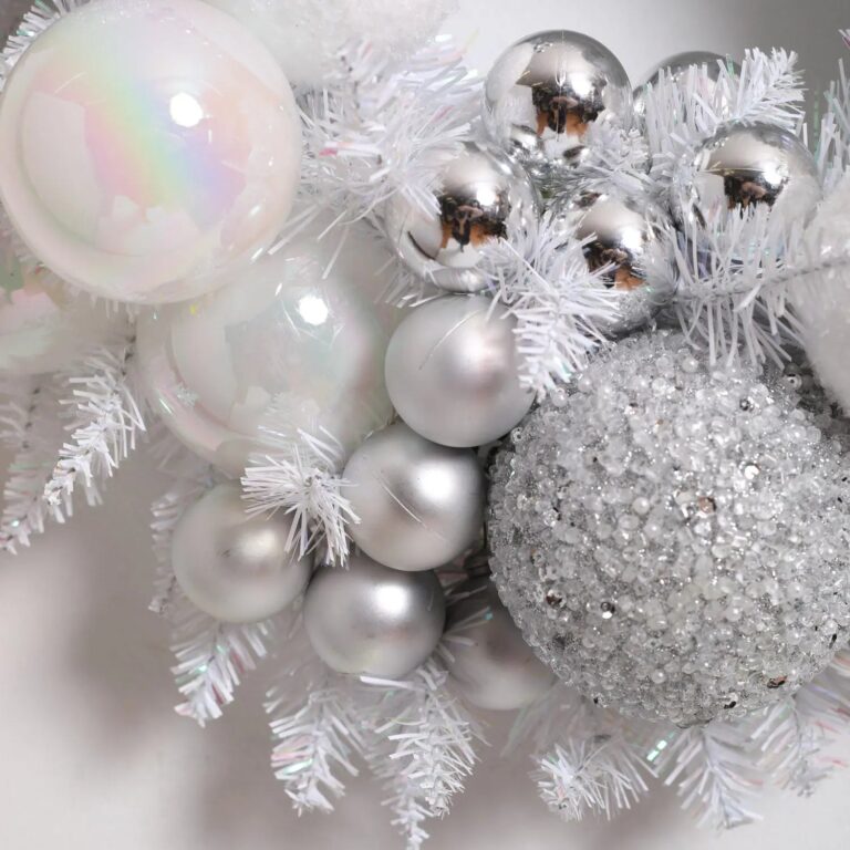 Close-up of blooms and berries on this Iridescent Pine and Mixed Pearlized Door Christmas Wreath