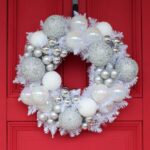 Detail view of layered greenery detail from the Iridescent Pine and Mixed Pearlized Door Christmas