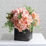 The Light Pink Hydrangea and Mixed Tin Window Planter shown in full, highlighting branch layering