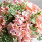 Side view of the Light Pink Hydrangea and Mixed Tin Window Planter revealing frond and