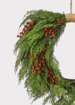 Close-up of blooms and berries on this Real Touch Cedar and Red Artificial Holiday Wreath