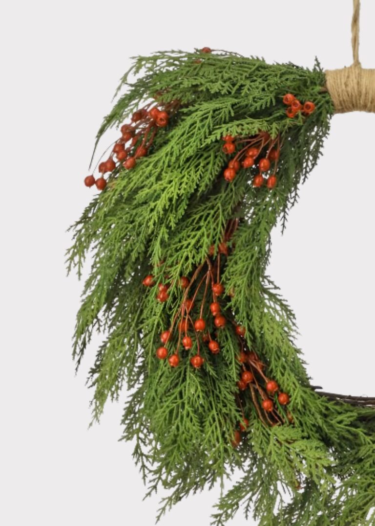Close-up of blooms and berries on this Real Touch Cedar and Red Artificial Holiday Wreath