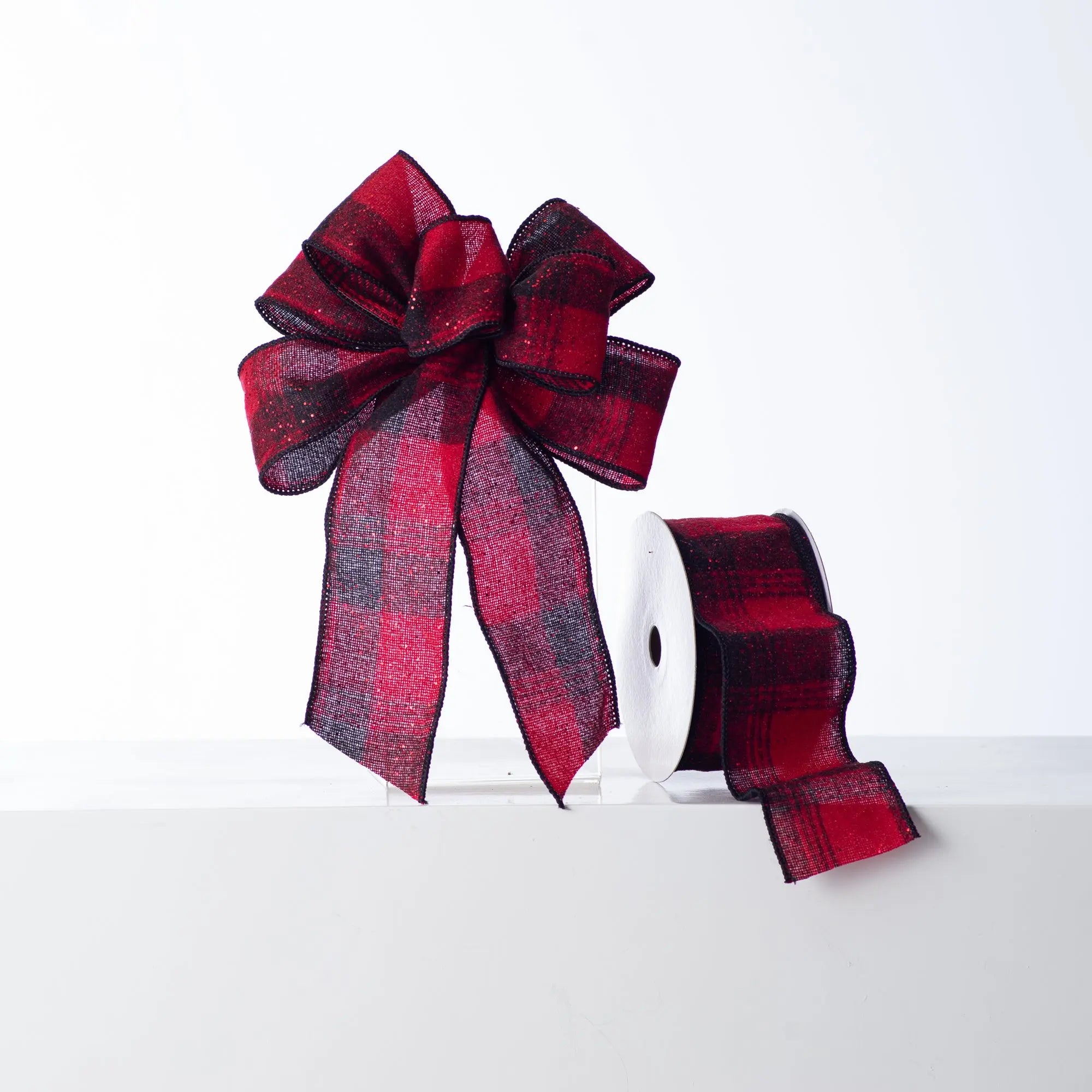 ORNAM1181-BowRedandBlackGlitteredPlaidFlannelHandTiedLoopBow_SpoolofRibbon_1.jpg Red and Black Glitter Plaid Flannel Hand - Tied Loop Bow and Spool of Ribbon