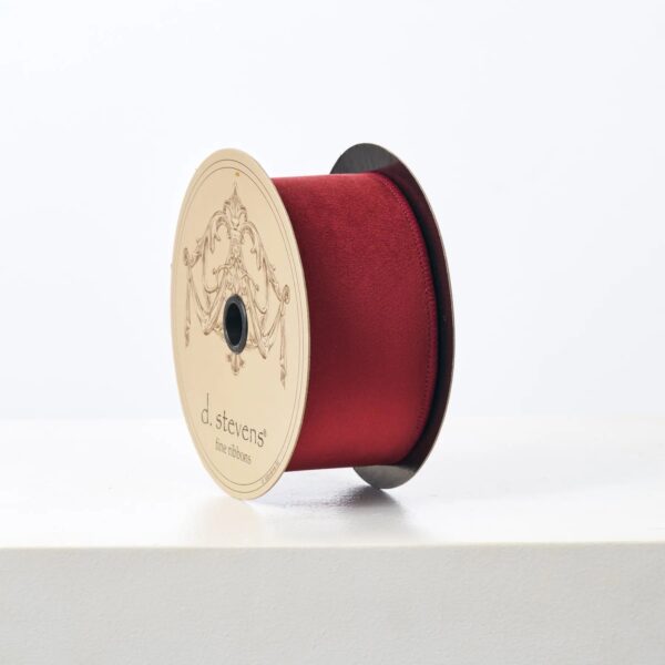 Close-up of blooms and berries on this D. Stevens Christmas Burgundy Red Lined Ribbon Spool