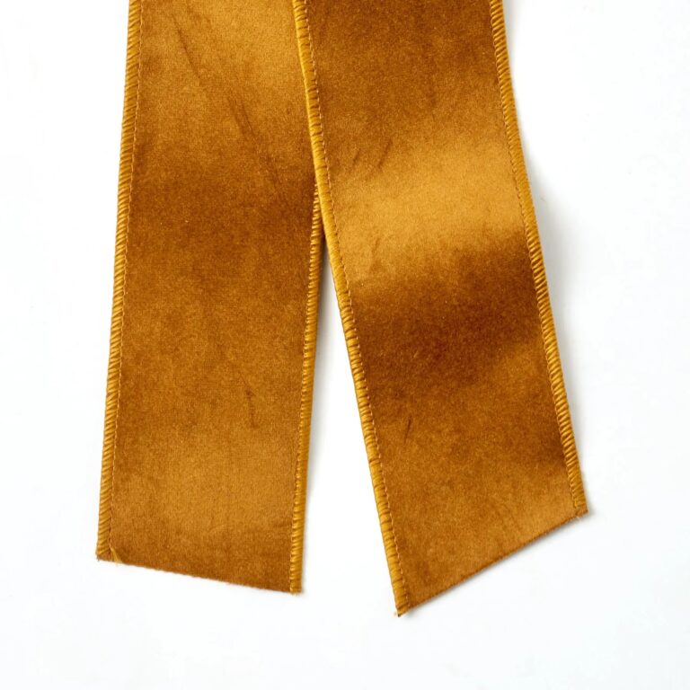 Close-up of blooms and berries on this Golden Brown Taffeta Wire Drape Loop Bow