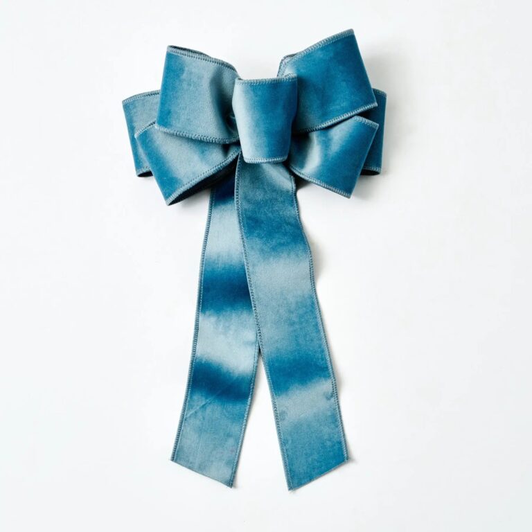 Close-up of blooms and berries on this Soft Blue Taffeta Wire Drape Loop Bow