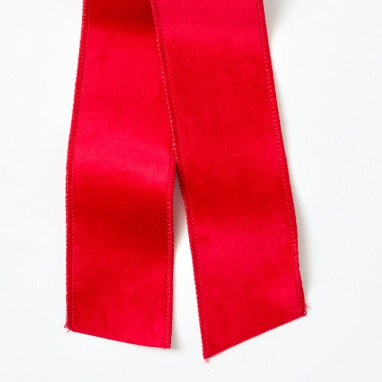 Close-up of blooms and berries on this Christmas Red Taffeta Wire Drape Loop Bow