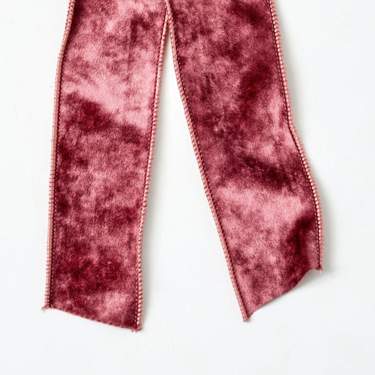 Close-up of blooms and berries on this Plum Raisin Velvet Wire Drape Loop Bow