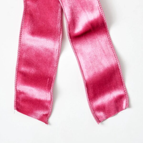 Close-up of blooms and berries on this Pretty Pink Velvet Wire Drape Loop Bow