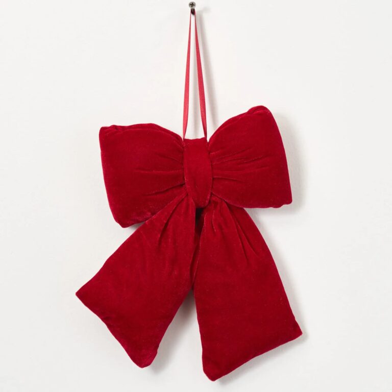 Close-up of blooms and berries on this Red Velvet Puffed Pillow Holiday Christmas Bow