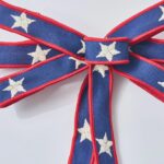 Close-up of blooms and berries on this Skinny Americana Blue Ribbon Tied Bow