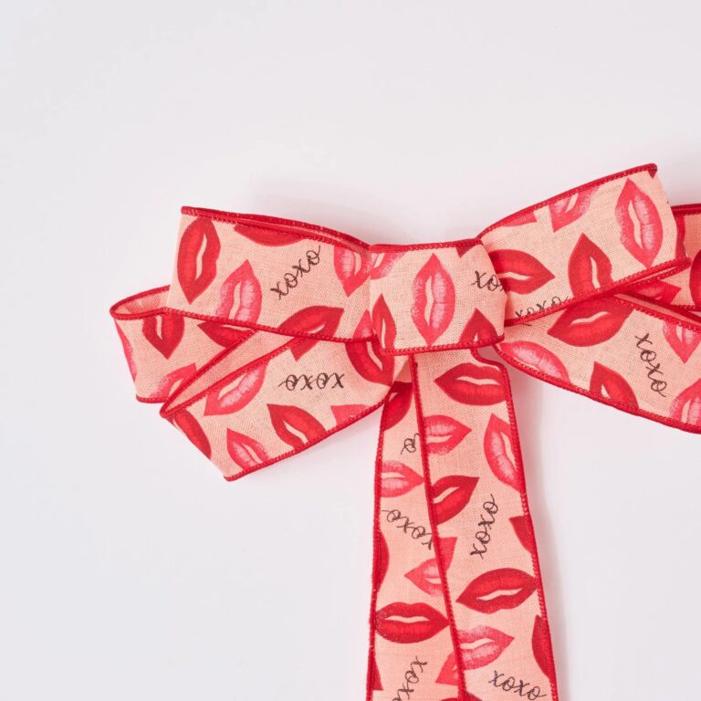 Close-up of blooms and berries on this XOXO Pink and Red Lips Hand Tied Bow