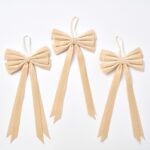 Close-up of blooms and berries on this Elegant Champagne Velvet Double Tailed Holiday Christmas Bow