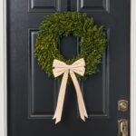The Elegant Champagne Velvet Double Tailed Holiday Christmas Bow shown in full, highlighting full wreath