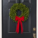 The Elegant Christmas Red Velvet Double Holiday Christmas Bow shown in full, highlighting full wreath