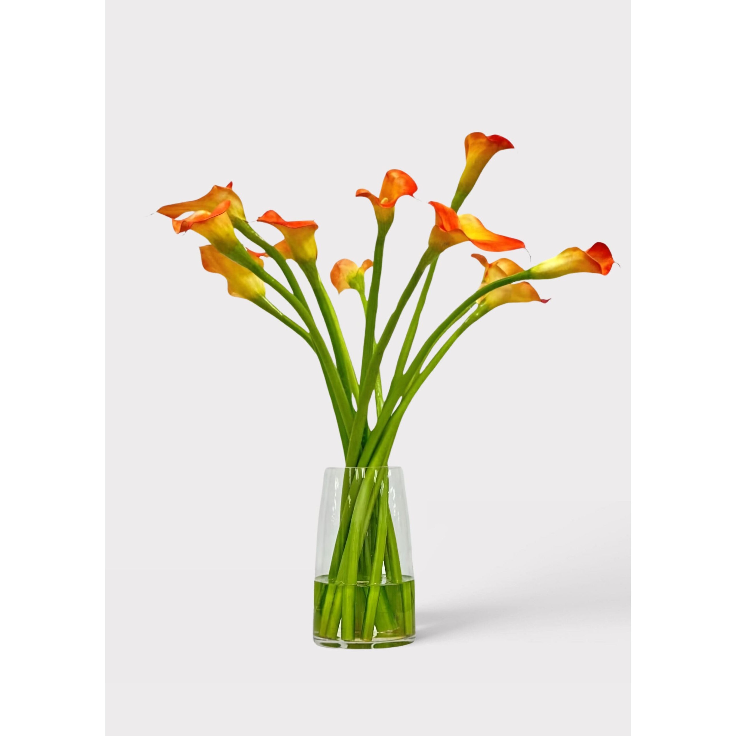 Orange-Artificial-Calla-Lily-Arrangement-in-Glass-Vase-scaled-sq Lily Artificial Arrangement in Glass Vase - 30" - Image 1