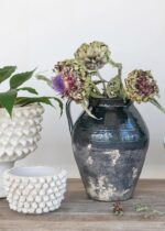 Alternate angle of the Distressed Terra Cotta Pitcher Vase Cotta Pitcher Vase showing bloom arrangement