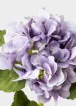Alternate angle of the Small Antique Lavender Hydrangea Fake Flower - 19 showing leaves along