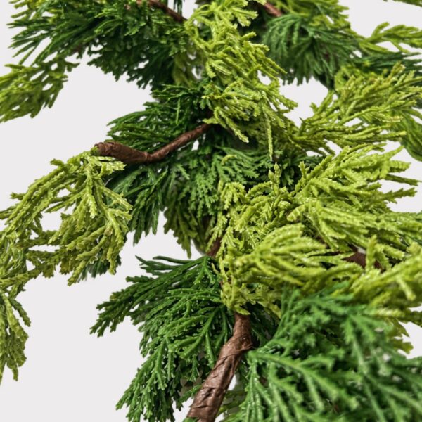 Close-up of greenery along the garland on this Real Touch Fake Cedar Christmas Christmas Greenery