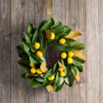 Alternate angle of the Real Touch Magnolia Leaves with Lemon Mini Wreath showing wreath face