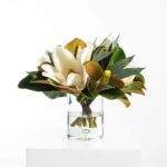 Alternate angle of the Real Touch White Magnolia Glass Cylinder Vase showing bloom arrangement in