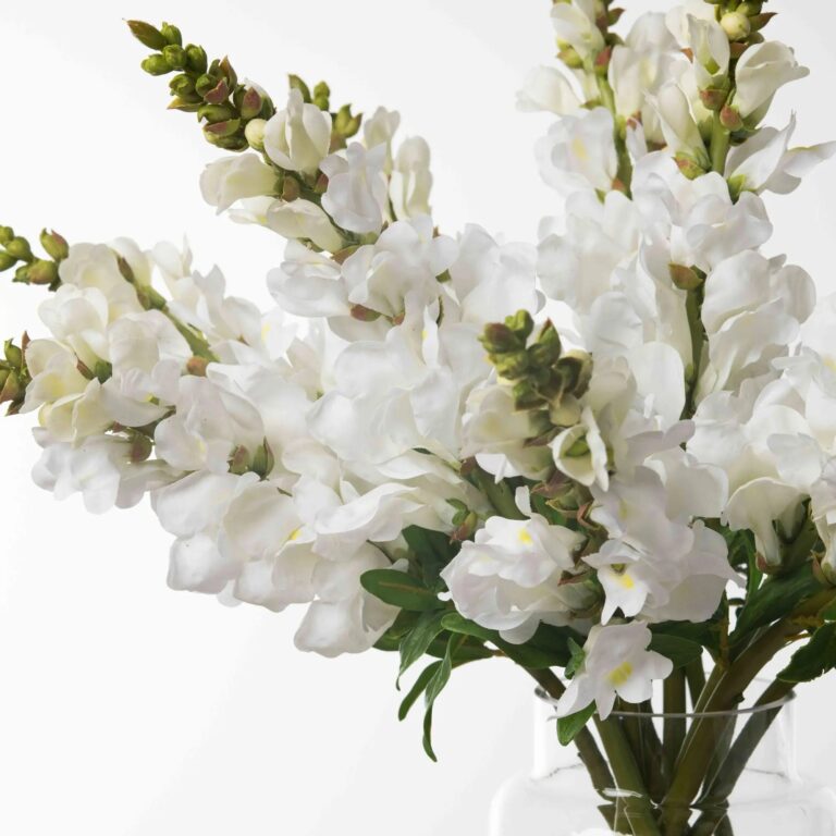 Close-up of vase silhouette detail on this Real Touch White Snapdragons Water Illusion Arrangement