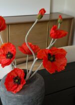 Alternate angle of the Faux Blooming Poppy Flowers in Orange - 29 showing leaves along