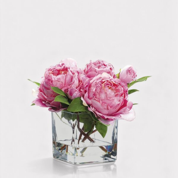 Close-up of vase silhouette detail on this Small Pink Faux Peony Arrangement Glass Vase