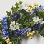 Close-up of blooms and berries on this Blue Larkspur and White Freesia Front Door Wreath