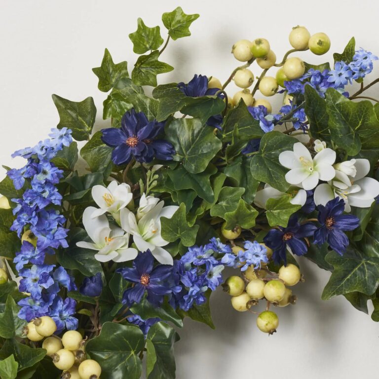 Close-up of blooms and berries on this Blue Larkspur and White Freesia Front Door Wreath