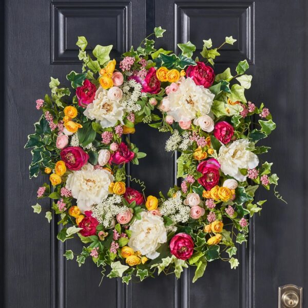 Close-up of blooms and berries on this White and Fuchsia Peony Front Door Wreath