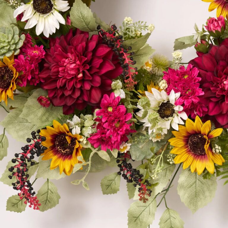 Close-up of blooms and berries on this Summer on the Farm Door Spring Wreath
