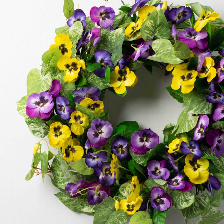 Close-up of blooms and berries on this Pansy Perfection - Mixed Yellow Front Door Wreath