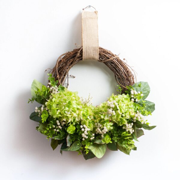 Close-up of blooms and berries on this Green Hydrangea, Gypsophila, and Eucalyptus Front Door Wreath
