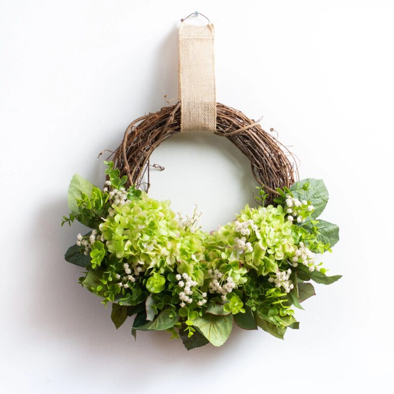 Close-up of blooms and berries on this Green Hydrangea, Gypsophila, and Eucalyptus Front Door Wreath
