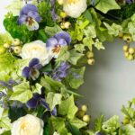 Close-up of blooms and berries on this Purple Lavender Pansy, Cream Camellia Front Door Wreath