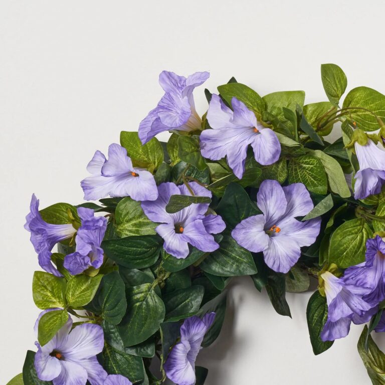 Close-up of blooms and berries on this Cascades of Blooming Purple Petunia Front Door Wreath