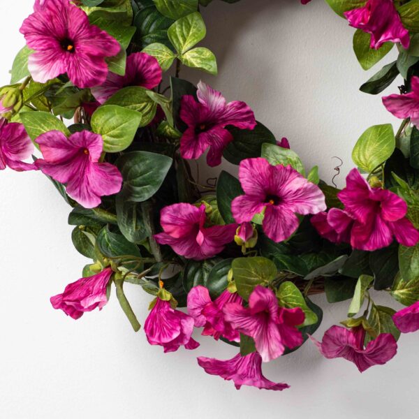 Close-up of blooms and berries on this Cascades of Blooming Magenta Petunia Front Door Wreath