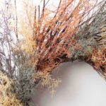 Close-up of blooms and berries on this Dreamy Coral Fern On Front Door Wreath