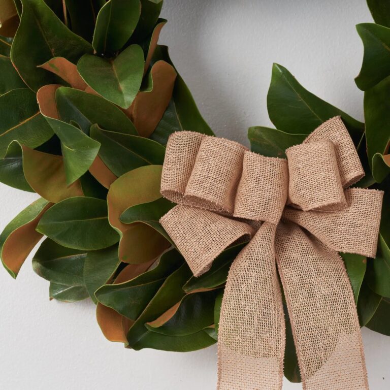 Close-up of blooms and berries on this Classic Real Touch Magnolia Leaf Burlap Bow