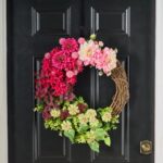 Alternate angle of the Cute As A Button Front Door Wreath showing wreath face texture