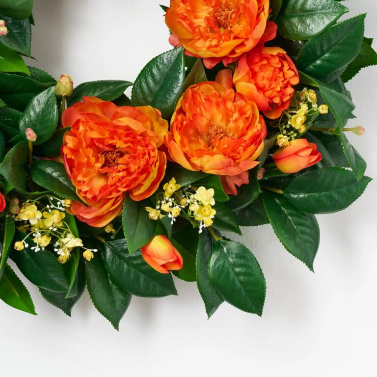 Close-up of blooms and berries on this Orange Garden Goddess - Orange Front Door Wreath