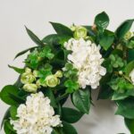 Close-up of blooms and berries on this Clover Patch - White Hydrangea, Day Spring Wreath