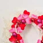 Close-up of blooms and berries on this Velvet Romance - Pink Valentine's Day Wreath