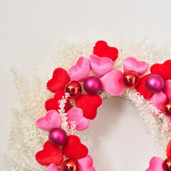 Close-up of blooms and berries on this Velvet Romance - Pink Valentine's Day Wreath