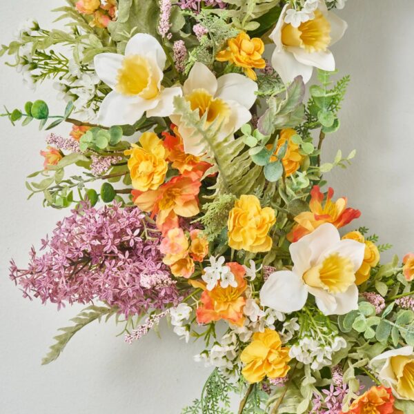 Close-up of blooms and berries on this Lilac and Daffodil Garden Gate Front Door Wreath