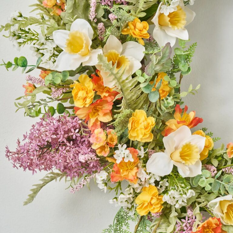 Close-up of blooms and berries on this Lilac and Daffodil Garden Gate Front Door Wreath