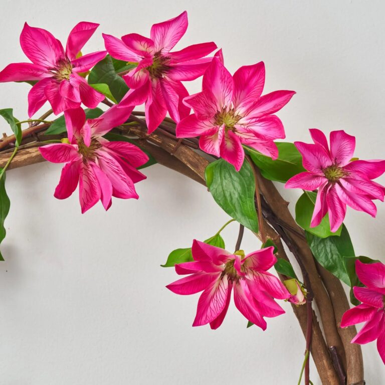 Close-up of blooms and berries on this Real Touch Climbing Fuchsia Pink Spring Summer Wreath