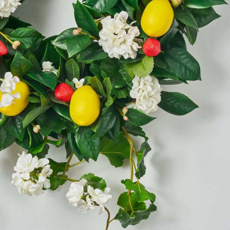 Close-up of blooms and berries on this Strawberry Lemonade - White Geranium Front Door Wreath